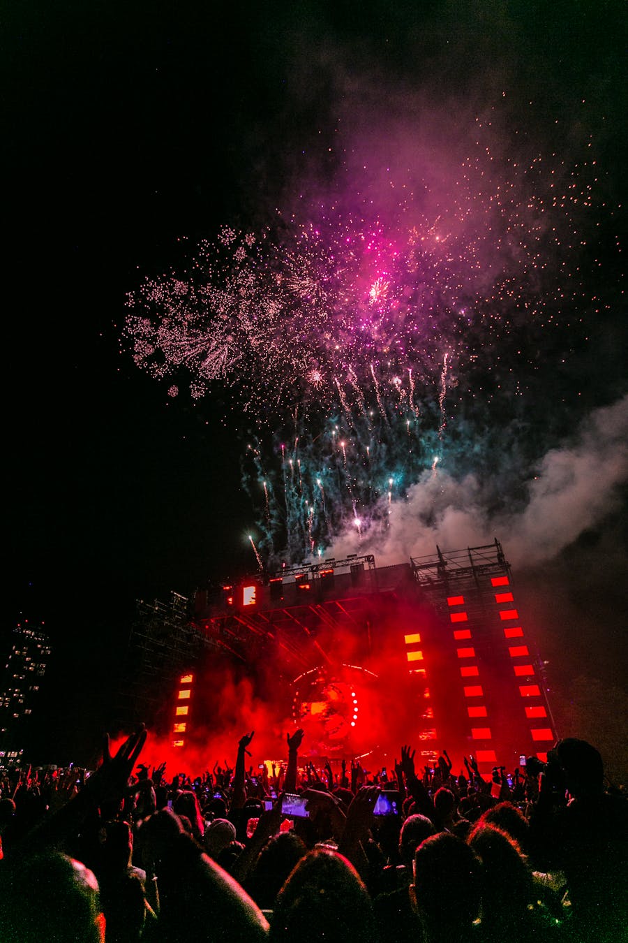 Colorful outdoor festival stage with crowds in Montreal